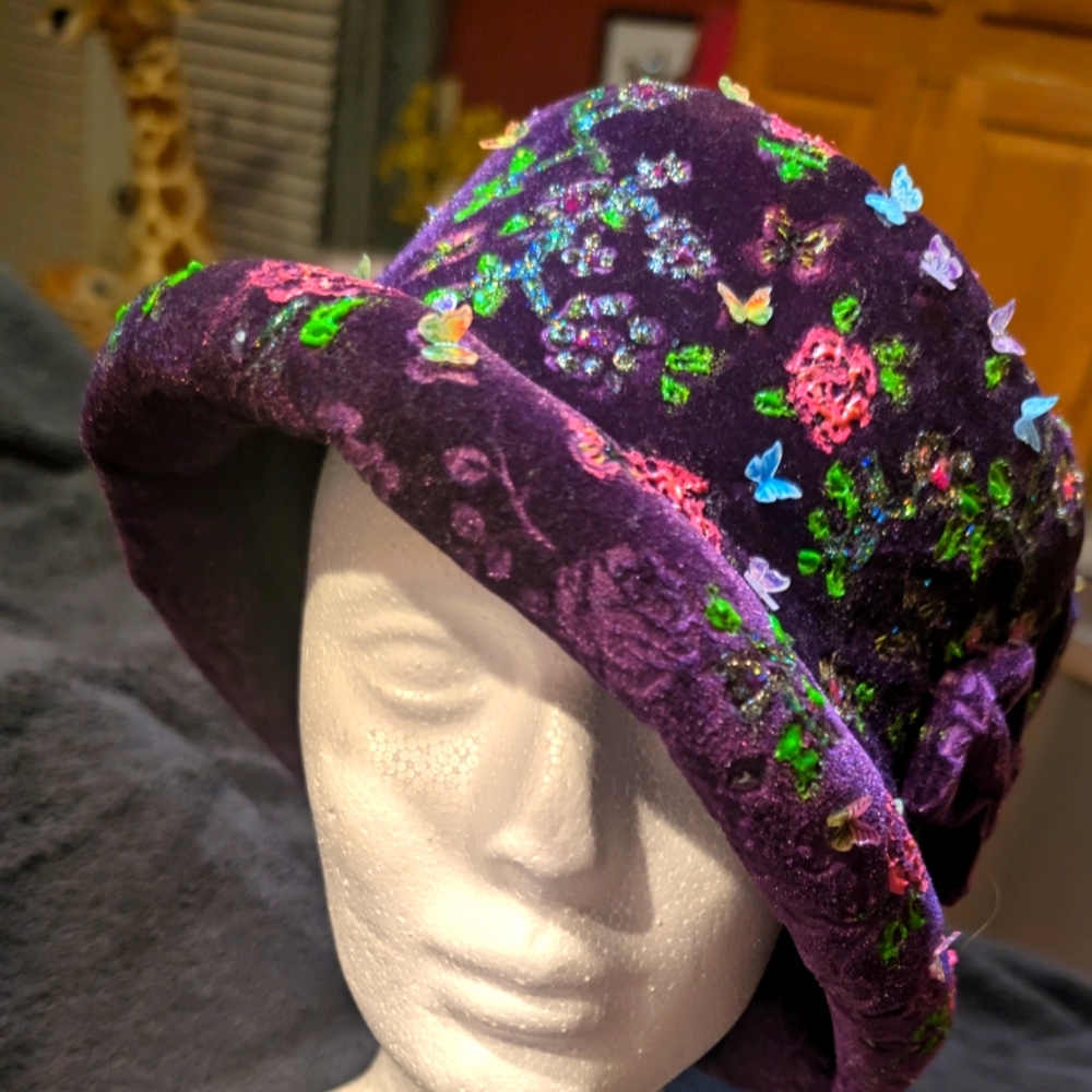 a purple velvet hand painted hat